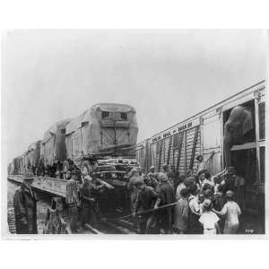  Men unloading Ringling Bros. and Barnum & Bailey wagons 