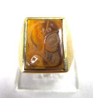 One gents 10k and Carved Tigers Eye ring. This ring has the profile of 