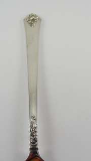   serving fork by Royal Crest Silver. It is in the Castle Rose pattern