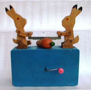   Antique Russian mechanical musical toy Two rabbit sawing carrot  