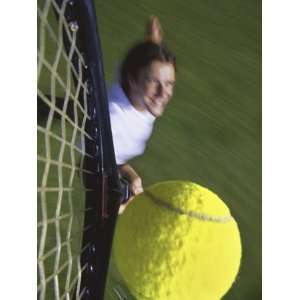  High Angle View of a Man Hitting a Tennis Ball Premium 